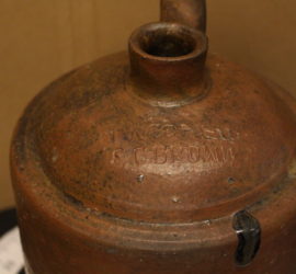 whisky jug stamped with two names